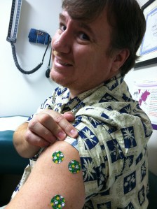 Zeke shows off his Snoopy band-aids