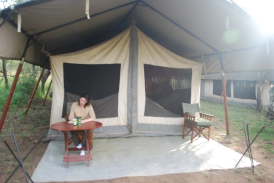 Amanda writes in her safari journal outside our tent at the Katikati camp.
