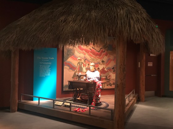 Seminole woman using a sewing machine