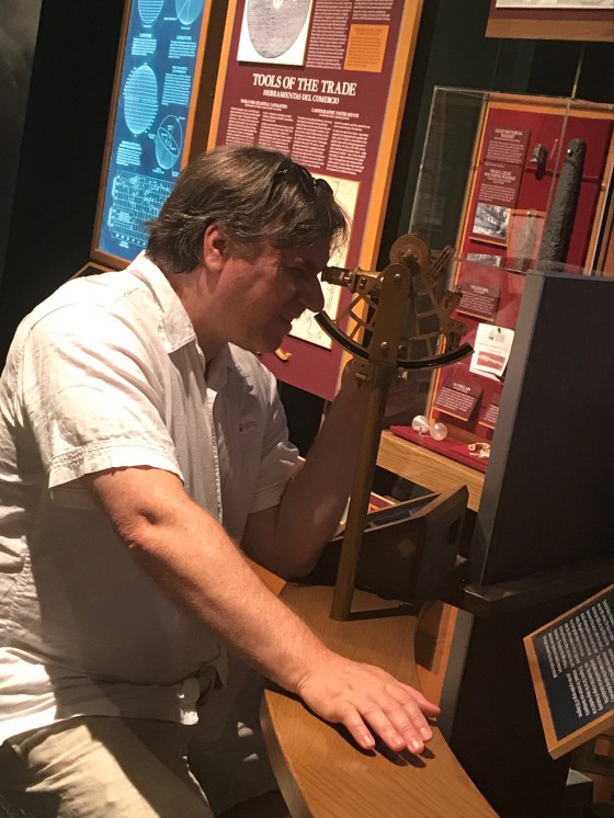 Learning how to use a sextant in the pirate exhibit